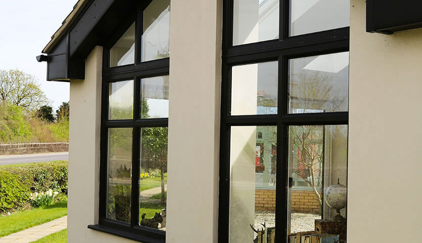 Tall black aluminium casement windows installation