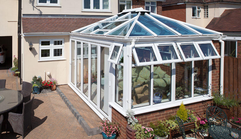 White uPVC Edwardian conservatory with a glass roof