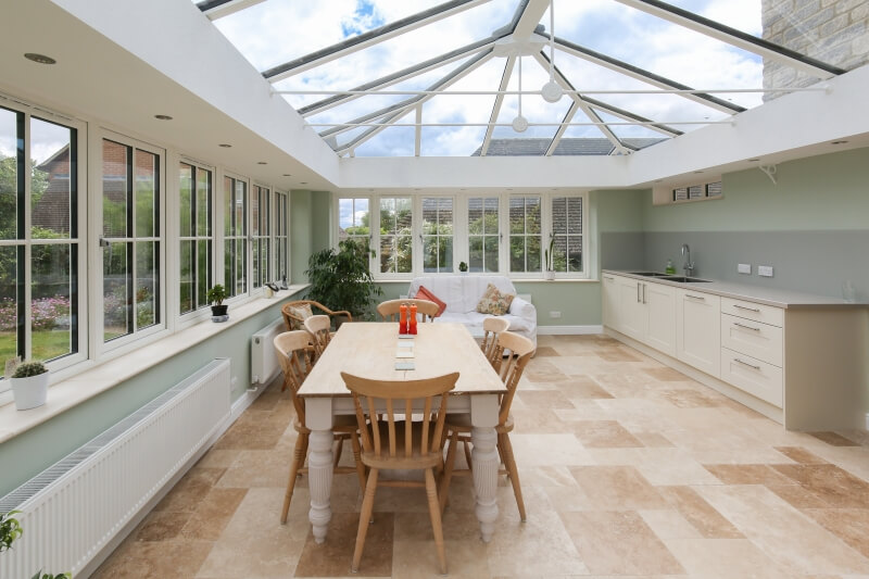 Inside a kitchen extension with glass roof.